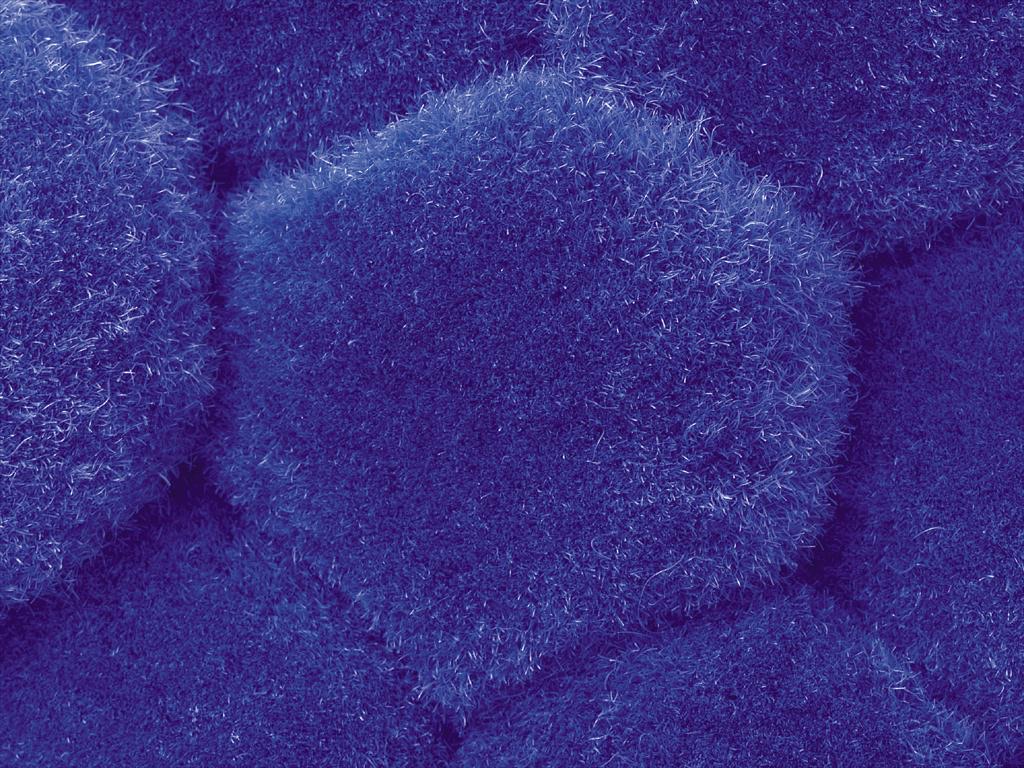 Macro view of blue pigmented textile fibre